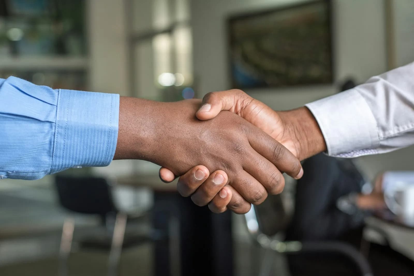 Business handshake in an office